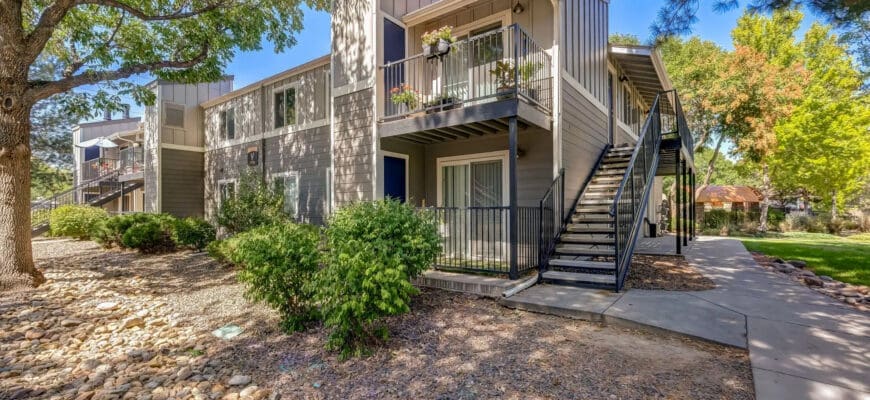 Exterior property view of Copper Flats showing surrounding rock gravel and greenery